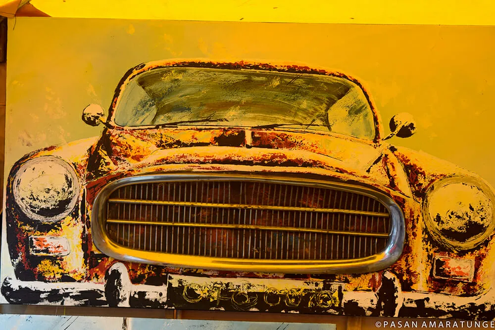 An artistic representation of an old car on canvas, highlighting its classic features and timeless appeal.