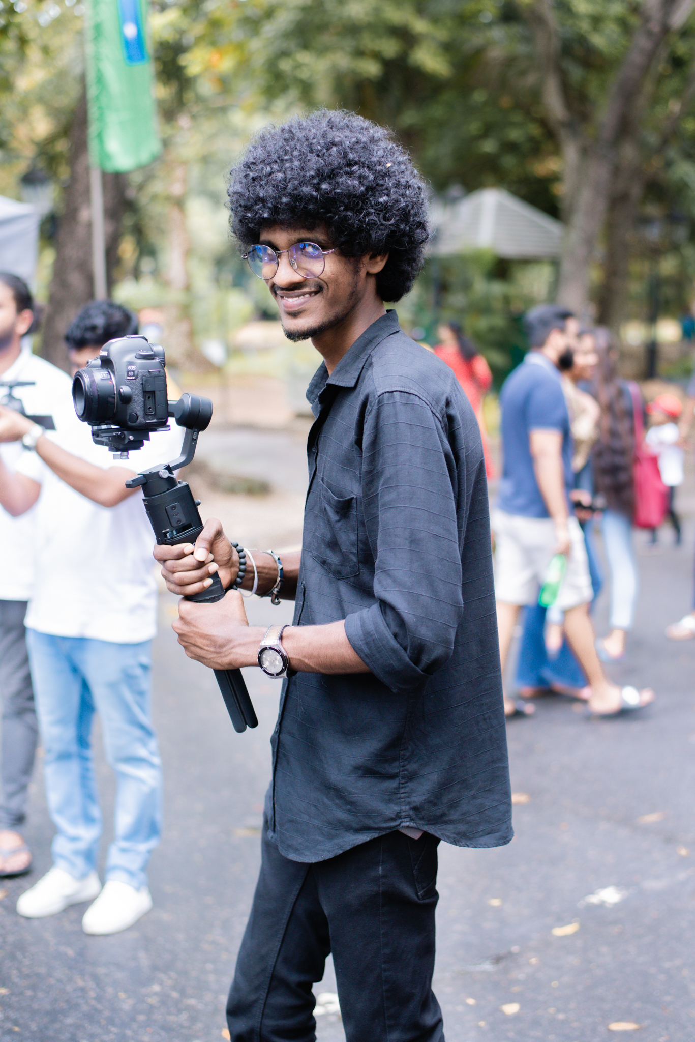 A man holding a camera appears to be capturing a moment 