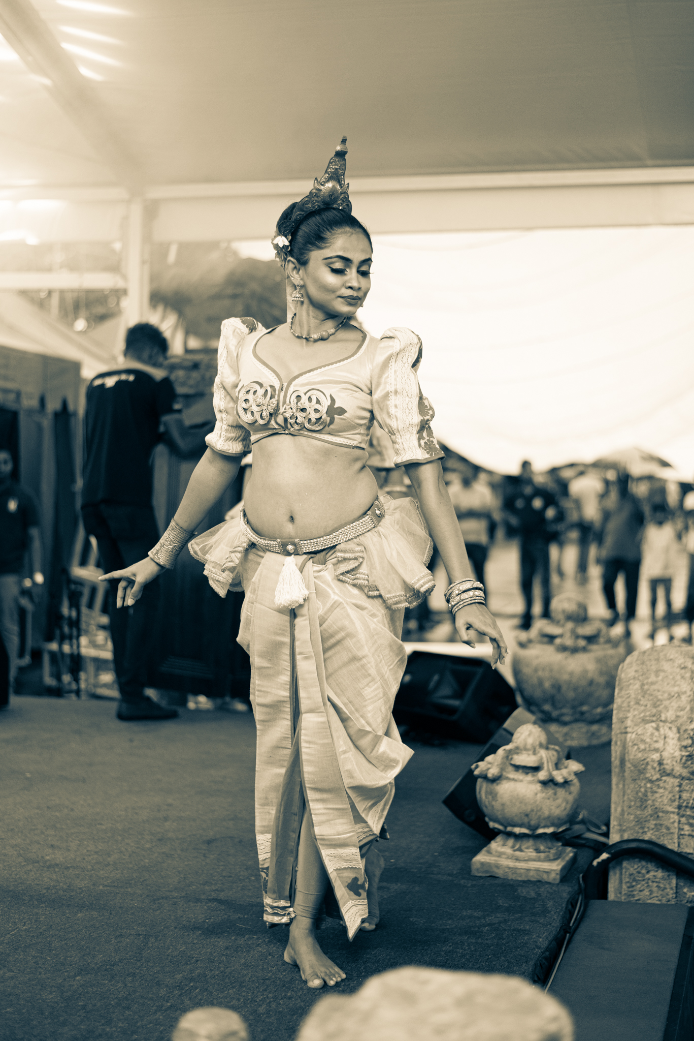 A group of dancers in traditional attire performs energetically on stage, showcasing cultural heritage and artistry.