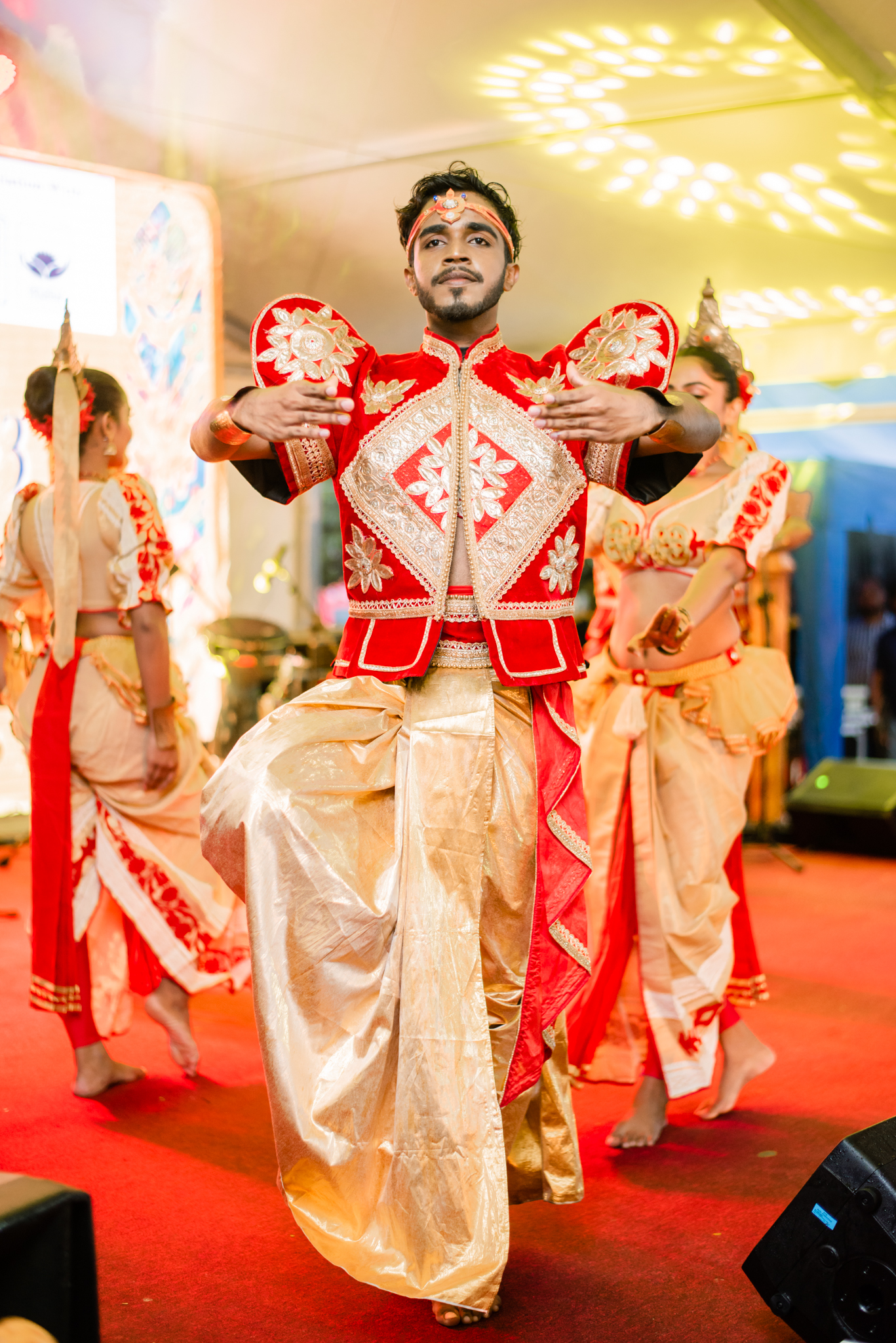 A lively gathering of people engaged in dance, expressing happiness and camaraderie in a festive atmosphere.