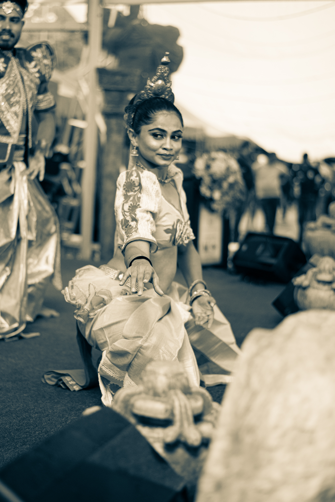 A diverse group of individuals joyfully dancing together in a lively atmosphere, showcasing unity and celebration.