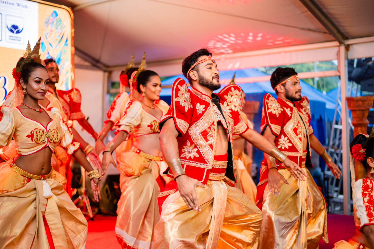A lively scene featuring a group of people dancing, embodying energy and togetherness in a celebratory moment.